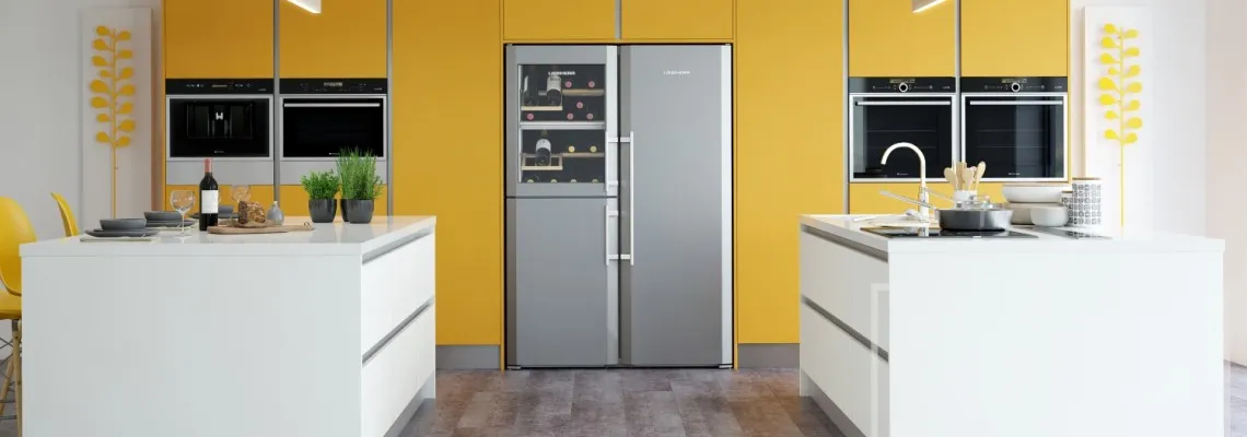 Image of kitchen with modern in-built appliances with yellow and white accents