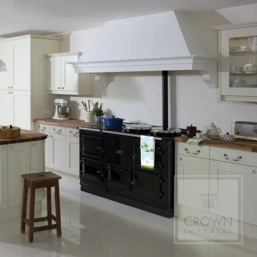 Image of kitchen using traditional wood counter tops and cream cabinets